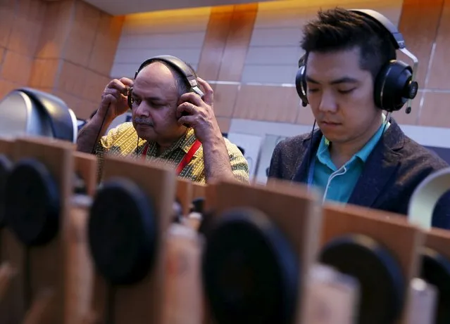 People test headphones during the CanJam headphone and personal audio expo in Singapore February 21, 2016. (Photo by Edgar Su/Reuters)