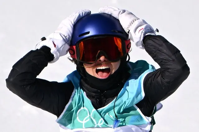China's Gu Ailing Eileen reacts as she competes in the freestyle skiing women's freeski big air final run during the Beijing 2022 Winter Olympic Games at the Big Air Shougang in Beijing on February 8, 2022. (Photo by Manan Vatsyayana/AFP Photo)
