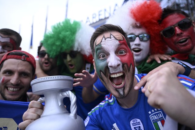 Italy supporters pose for a picture ahead of the UEFA Euro 2024 Group B football match between Spain and Italy at the Arena AufSchalke in Gelsenkirchen on June 20, 2024. (Photo by Ina Fassbender/AFP Photo)