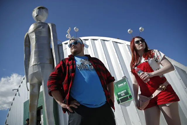 Jackson Carter and Veronica Savage wait for passes to enter the Storm Area 51 Basecamp event Friday, Sept. 20, 2019, in Hiko, Nev. The event was inspired by the “Storm Area 51” internet hoax. (Photo by John Locher/AP Photo)