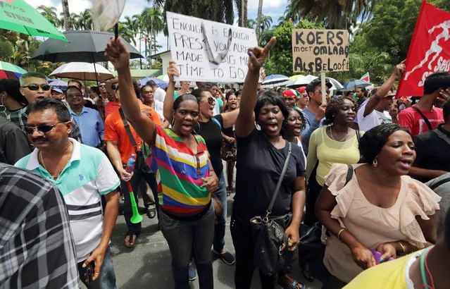 Demonstrators protest against the government of President Desi Bouterse for a mandated increase in fuel prices and its plans to sign an agreement with the IMF to help pull the country out of an economic crisis, according to government sources in Paramaribo, Suriname, May 13, 2016. (Photo by Ranu Abhelakh/Reuters)