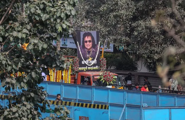 A vehicle with mortal remains of late Indian singer, composer and politician Bappi Lahiri arrives at crematorium ground during his funeral procession in Mumbai, India, 17 February 2022. Bappi Lahiri passed away at 69 in Mumbai after being treated at hospital for the past month. (Photo by Divyakant Solanki/EPA/EFE)