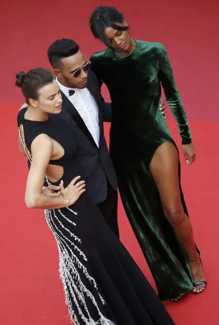 Formula One driver Lewis Hamilton of Britain (C) poses on the red carpet as she arrives for the screening of the film “La fille inconnue” (The Unknown Girl) in competition at the 69th Cannes Film Festival in Cannes, France, May 18, 2016. (Photo by Regis Duvignau/Reuters)