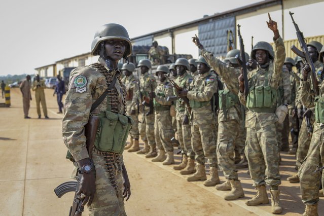 Soldiers from the South Sudan People's Defence Forces (SSPDF) prepare to board a flight to transport them to eastern Congo, where they are due to operate as part of the East Africa Community Regional Force (EACRF), at the airport in Juba, South Sudan Monday, April 3, 2023. East African regional forces have regained control of Bunagana, a strategic town in eastern Congo that had been held by M23 rebels for more than nine months, a spokesman for the regional force said Monday. (Photo by Samir Bol/AP Photo)