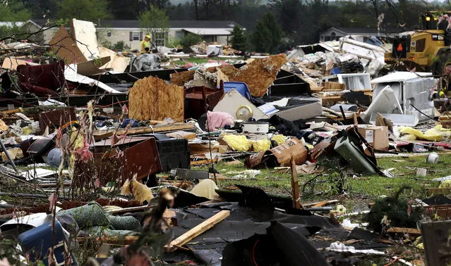 Debris from buildings and household goods scatter after a tornado ripped through Prairie Lake Estates trailer home park, just north of Chetek, Wis., Tuesday, May 16, 2017. The tornado swept into the mobile home park in western Wisconsin on Tuesday, as a storm system also pounded parts of at least seven states from Texas to near the Canadian border with heavy rain, high winds and hail. (Photo by Dan Reiland/The Eau Claire Leader-Telegram via AP Photo)