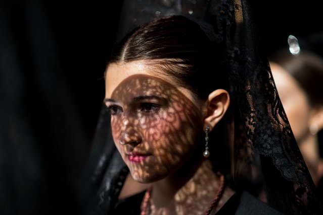 A woman dressed typical “Mantilla” takes part in the procession of Holy Monday on April 03, 2023 in Granada, Spain. In the last week of Lent, prior to Easter, cities and towns across Spain feature Catholic groups performing processional tributes to the Passion of Jesus Christ. (Photo by Carlos Gil Andreu/Getty Images)