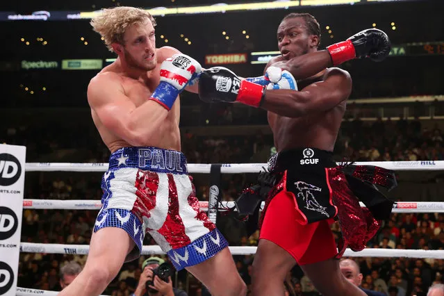 Logan Paul (red/white/blue shorts) and KSI (black/red shorts) exchange punches during their pro debut fight at Staples Center on November 9, 2019 in Los Angeles, California. KSI won by decision. (Photo by Ed Mulholland/Matchroom Boxing USA)