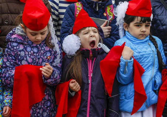 Members of the Russian Young Pioneers attend a ceremony, organized by the Russian Communist Party, welcoming new members to the organization, in Red Square, Moscow, 21 May 2017. The organization, a relic of the Soviet era and totalitarian society, was an element of communist education and propaganda at school. Russian schools are currently reviving and promoting the moral values of the pioneer organisations. (Photo by Sergei Ilnitsky/EPA)