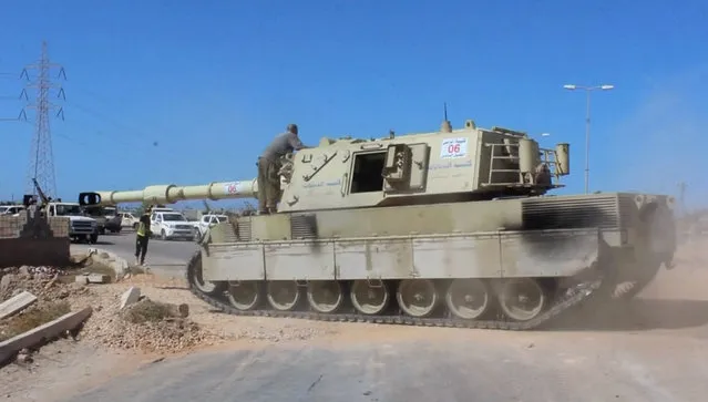 A tank belonging to forces aligned with Libya's new unity government is seen on the road as they advance on the eastern and southern outskirts of the Islamic State stronghold of Sirte, in this still image taken from video on June 9, 2016. (Photo by Reuters TV)