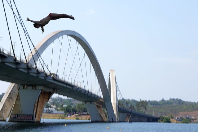 Canada's Alex Tiaglei competes at the World Aquatics High Diving Junior Championships by the JK Bridge in Brasilia, Brazil, October 11, 2024. (Photo by Eraldo Peres/AP Photo)