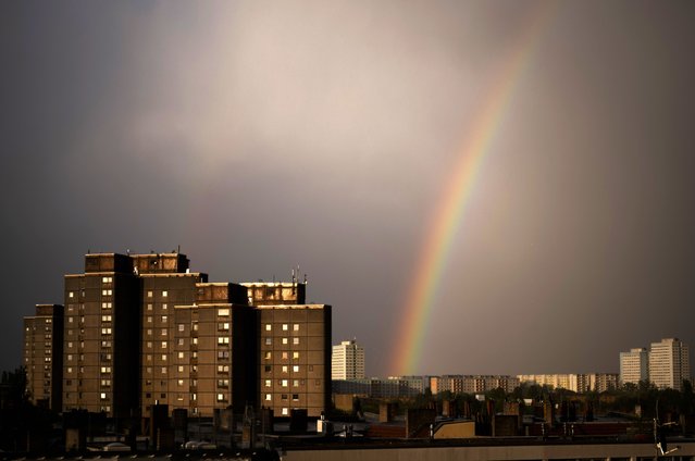 A rainbow appears in the sky over residents buildings in the German capital during a thunderstorm in Berlin, Tuesday, April 16, 2024. (Photo by Markus Schreiber/AP Photo)