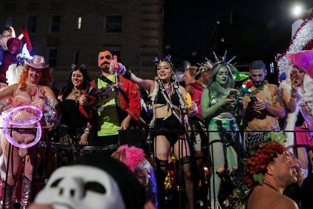 People take part in the annual NYC Halloween Parade in New York City on October 31, 2024. (Photo by Jeenah Moon/Reuters)