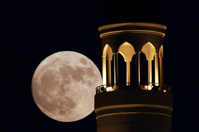 The “Blue Moon” rises over Doha city on August 30, 2023. (Photo by Karim Jaafar/AFP Photo)