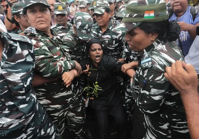 Indian security personnel detain Congress Members during a protest march against Indian Government, in New Delhi, India, 05 August 2022. Indian Congress MPs were detained while they were trying to march towards President House to protest against the Bharatiya Janata Party (BJP)-led government for rising prices of essential commodities, alleged high unemployment rates and imposing Goods and Services tax on various commodities. (Photo by Rajat Gupta/EPA/EFE/Rex Features/Shutterstock)