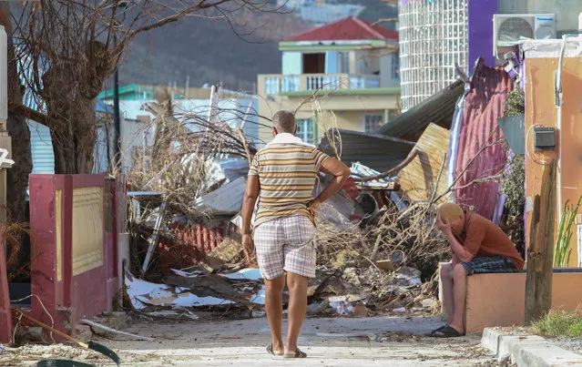 Residents observe the damage left by Hurricane Irma on September 11, 2017 in Philipsburg, St. Maarten. The Caribbean island sustained extensive damage from the powerful storm. (Photo by Jose Jimenez/Getty Images)