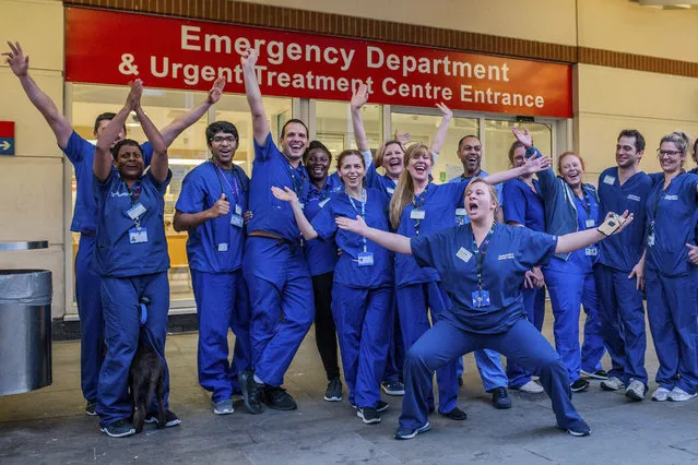 Hospital staff come out of Chelsea and Westminster and are greeted by a small but enthusiastic crowd, including several car loads of Met Police Officers – Clap for carers, to say thanks to NHS and other key workers and carers on April 16, 2020. The “lockdown” continues in Clapham – Coronavirus (Covid 19) outbreak in London. (Photo by Guy Bell/Rex Features/Shutterstock)