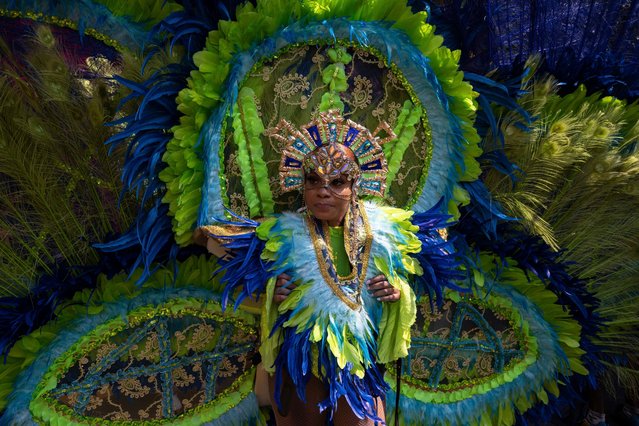 A participant in costume walks during the West Indian Day Parade, Monday, September 5, 2022, in the Brooklyn borough of New York. (Photo by Yuki Iwamura/AP Photo)