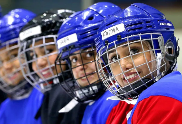 Members of Kuwait' s women' s ice hockey team take part in a training session at the ski lounge in Kuwait City on September 29, 2017. Fifty- six Kuwaiti women between the ages of 15 and 30 are now the proud owners of team jerseys emblazened with their names on the back – some of them mothers who frequently bring their children to training. (Photo by Yasser Al-Zayyat/AFP Photo)