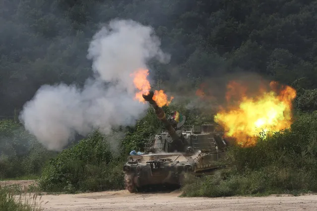 A South Korean army's K-55 self-propelled howitzer fires during a military exercise in Yeoncheon near the border with North Korea, South Korea, Thursday, August 18, 2016. South Korea's army says it has conducted its largest-ever artillery drills near the tense border with North Korea. (Photo by Lim Byung-shick/Yonhap via AP Photo)