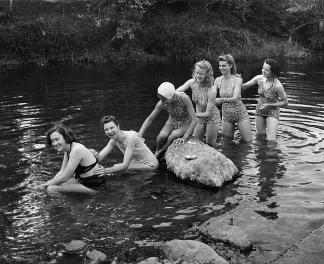 A nearby stream affords this group of U.S. Army nurses stationed in New Caledonia an excellent place to swim and bathe on September 28, 1942. Swimming, hiking and hunting are virtually the only recreations available to the nurses on the island. (Photo by Wallace Kirkland/AP Photo/Life)