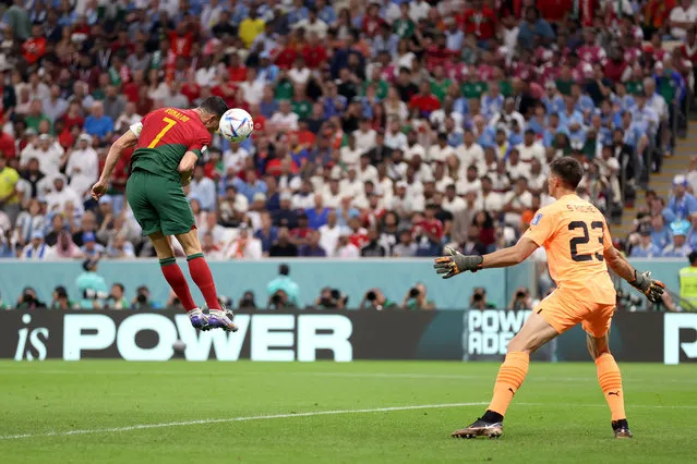 Cristiano Ronaldo of Portugal scores their team's first goal during the FIFA World Cup Qatar 2022 Group H match between Portugal and Uruguay at Lusail Stadium on November 28, 2022 in Lusail City, Qatar. (Photo by Lars Baron/Getty Images)