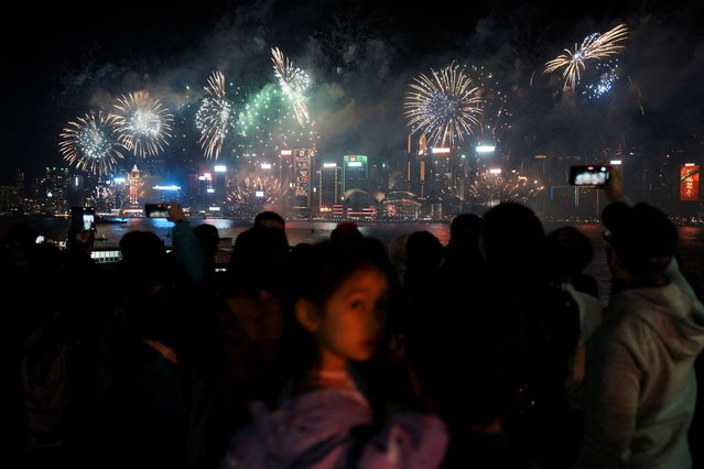 Fireworks explode over the Victoria Harbour on the second day of the Lunar New Year of the Dragon, in Hong Kong on February 11, 2024. (Photo by Lam Yik/Reuters)