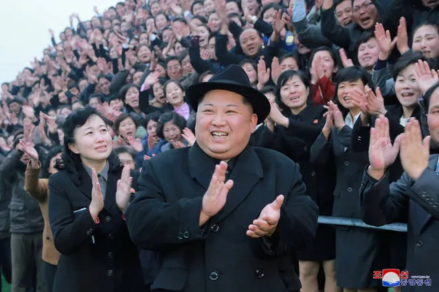 North Korean leader Kim Jong Un reacts as people applaud during his visit to the newly-remodeled Pyongyang Teacher Training College, in this photo released by North Korea's Korean Central News Agency (KCNA) in Pyongyang on January 17, 2018. (Photo by Reuters/KCNA)