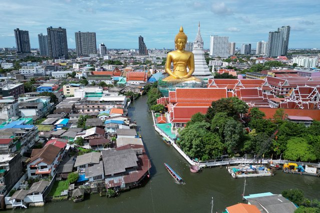 This aerial photo taken on July 18, 2025 shows the giant Buddha statue at the Wat Paknam Phasi Charoen Buddhist temple complex in Bangkok. (Photo by Watsamon Tri-Yasakda/AFP Photo)
