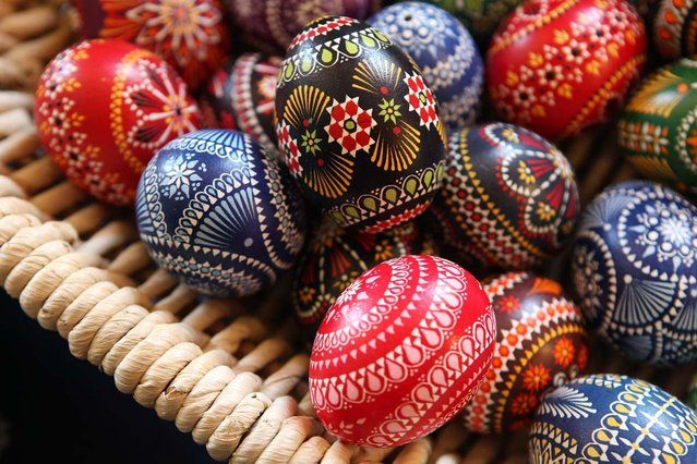 Painted Easter eggs sit on display for sale at the annual Sorbian Easter market on March 16, 2013 in Schleife, Germany. Easter is a particularly important time of year for Sorbs, a Slavic minority in eastern Germany, and the period includes the tradition of painting Easter eggs that include visual elements intended to ward off evil. Many Sorbs still speak Sorbian, a language closely related to Polish and Czech.  (Photo by Adam Berry)