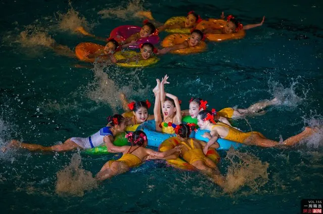 Young North Korean synchronized swimmers perform at an exhibition event in Pyongyang on Friday, February 15, 2013. (Photo by David Guttenfelder/AP Photo)