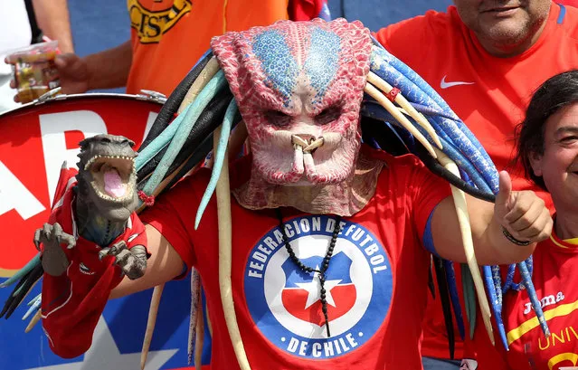 Football Soccer, Ecuador vs Chile, World Cup 2018 Qualifier, Olimpico Atahualpa Stadium, Quito, Ecuador on October 6, 2016. A fan supporting Chile wears a mask. (Photo by Guillermo Granja/Reuters)