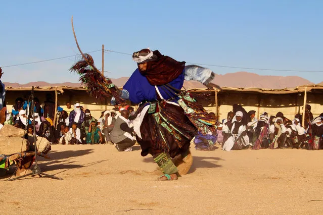 In this photo taken Saturday February 17, 2018, a man performs during a festival in Iferouane, Niger. (Photo by Ludivine Laniepce/AP Photo)