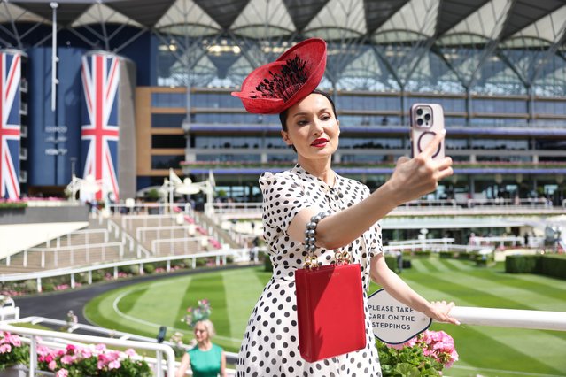 A race-goer poses for a selfie during Royal Ascot in Ascot, Britain, 17 June 2025. Royal Ascot is the United Kingdom's most valuable horse race meeting and social event running from 17 to 21 June 2025. (Photo by Neil Hall//EPA/EFE)