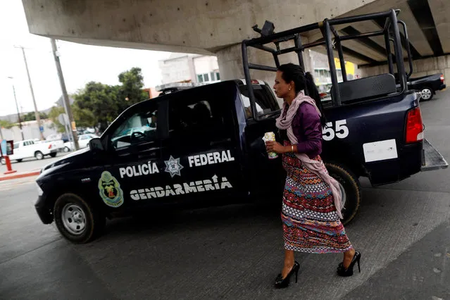 Channel walks on a street before she is expected to apply for asylum, in Tijuana, Mexico May 1, 2018. (Photo by Edgard Garrido/Reuters)