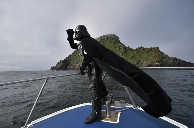 A Star Wars fan dressed as the character Darth Vader takes a boat trip to the Skelligs on International Star Wars day May 4, 2018 in Portmagee, Ireland. (Photo by Charles McQuillan/Getty Images)