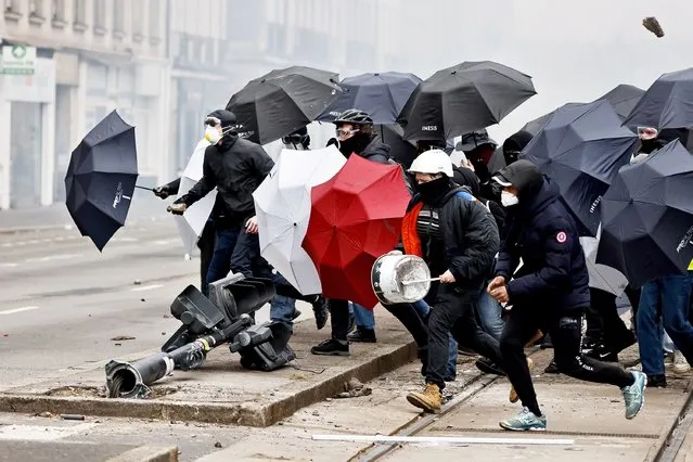 Youths clash with police forces during a protest Thursday, April 6, 2023 in Nantes, western France. Hundreds of thousands of people are expected to fill the streets of France Thursday for the 11th day of nationwide resistance to a government proposal to raise the retirement age from 62 to 64. The furious public reaction to the plan has cornered and weakened French President Emmanuel Macron. (Photo by Jeremias Gonzalez/AP Photo)