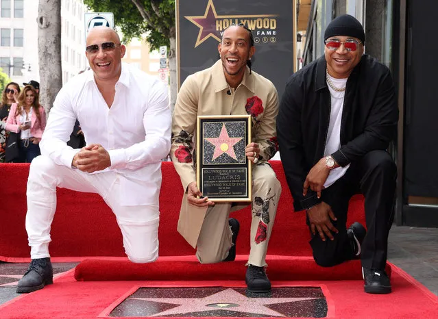 Rapper Ludacris, Vin Diesel and LL Cool J attend the unveiling of rapper Ludacris' star on the Hollywood Walk Of Fame, in Los Angeles, California, U.S. May 18, 2023. (Photo by Mario Anzuoni/Reuters)