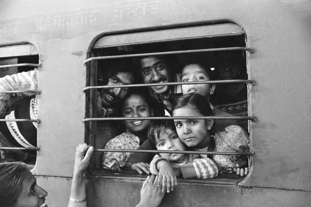 Happy, bewildered, or just tired, these are some of the faces on a crowded train leaving Bhopal station as rumors made people leave their homes in case further gas leaks occurred at the Union Carbide plant, December 12, 1984. (Photo by Peter Kemp/AP Photo)
