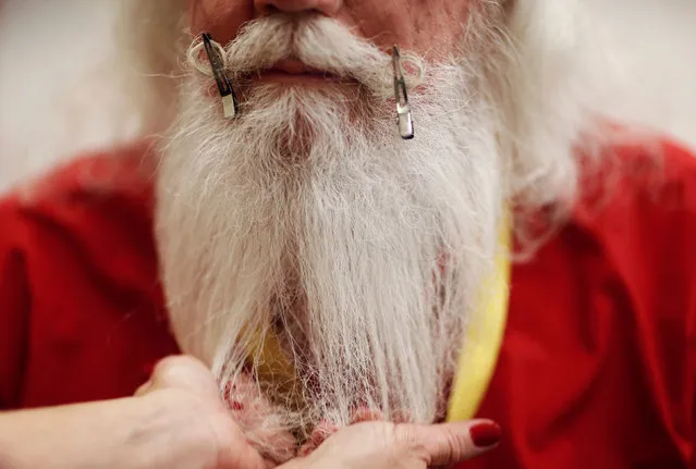 Santa Lamar May of Dallas, Georgia is shown how to groom his beard and moustache during classes at the Charles W. Howard Santa Claus School in Midland, Michigan, U.S. October 27, 2016. (Photo by Christinne Muschi/Reuters)