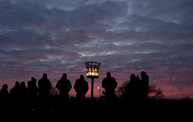 The Charnwood Grove of Druids gather for a public winter solstice ritual on Beacon Hill near Loughborough, Britain December 18, 2016. (Photo by Darren Staples/Reuters)