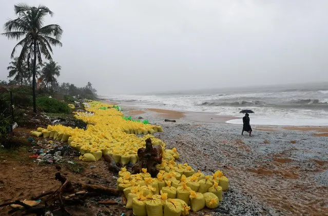 Sacks of collected plastic pellets washed off to a beach from the MV X-Press Pearl cargo ship, which caught fire and sank off the Colombo Harbour, are seen in Ja-Ela, Sri Lanka on June 3, 2021. (Photo by Dinuka Liyanawatte/Reuters)