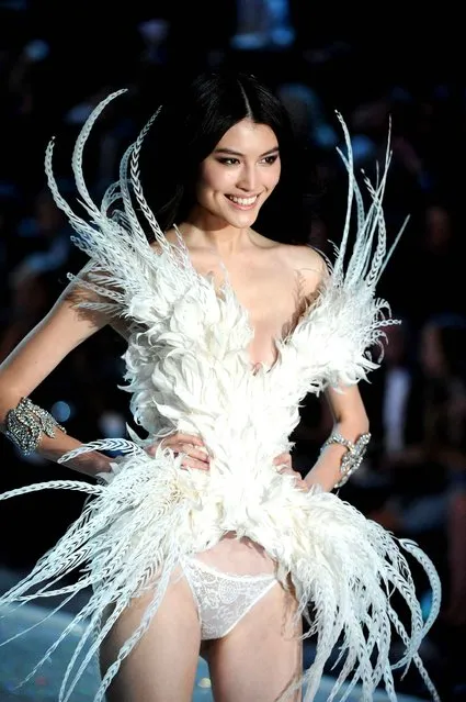 Model Sui He walks the runway at the 2013 Victoria's Secret Fashion Show at Lexington Avenue Armory on November 13, 2013 in New York City. (Photo by Bryan Bedder/Getty Images for Victoria's Secret)