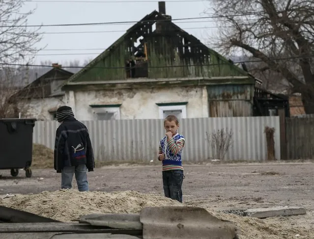 Children play in the eastern town of Slaviansk in Donetsk region March 12, 2015. (Photo by Gleb Garanich/Reuters)