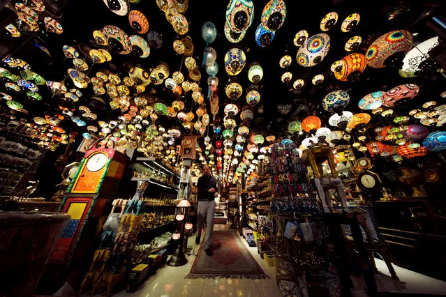 A visitor is seen walking in a traditional Arabic design lights shop in down town Manama, Bahrain, December 10, 2018. (Photo by Hamad I Mohammed/Reuters)