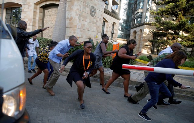 People run as they are evacuated at the scene where explosions and gunshots were heard at the Dusit hotel compound, in Nairobi, Kenya on January 15, 2019. (Photo by Thomas Mukoya/Reuters)