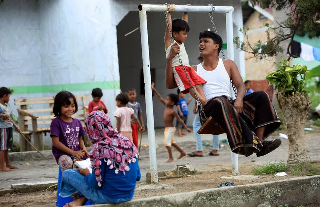 Rohingya asylum seekers spend their time inside a shelter in Medan, North Sumatra, Indonesia, 28 November 2016. According to media reports, hundreds of Rohingya remain stuck in detention centers and refugee camps in Indonesia. The UN said up to 30,000 people have been displaced and dozens died in clashes with the military in latest violence in Myanmar. The Rohingya are not recognized as citizens by the Myanmar's government. (Photo by Dedi Sinuhaji/EPA)