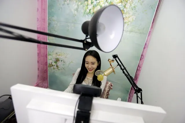 Online hostess Sun Xiaohou smiles as she gives a live broadcast in Beijing April 4, 2015. (Photo by Jason Lee/Reuters)