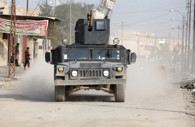 A military vehicle of Iraqi security forces is seen during a battle with Islamic State militants, in al-Zuhoor neighborhood of Mosul, Iraq, January 8, 2017. (Photo by Azad Lashkari/Reuters)