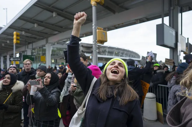 A protester raises her fist and shouts as she joins others assembled at John F. Kennedy International Airport in New York, Saturday, Jan. 28, 2017 after two Iraqi refugees were detained while trying to enter the country. On Friday, January 27, President Donald Trump signed an executive order suspending all immigration from countries with terrorism concerns for 90 days. Countries included in the ban are Iraq, Syria, Iran, Sudan, Libya, Somalia and Yemen, which are all Muslim-majority nations. (Photo by Craig Ruttle/AP Photo)