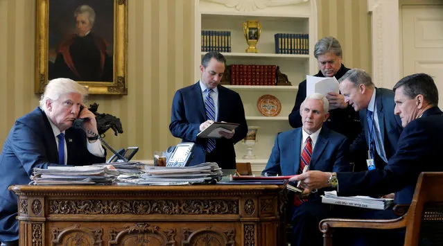 U.S. President Donald Trump (L-R), joined by Chief of Staff Reince Priebus, Vice President Mike Pence, senior advisor Steve Bannon, Communications Director Sean Spicer and National Security Advisor Michael Flynn, speaks by phone with Russia's President Vladimir Putin in the Oval Office at the White House in Washington, U.S. January 28, 2017. (Photo by Jonathan Ernst/Reuters)